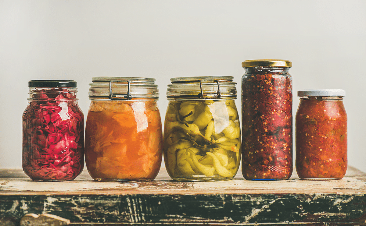 Jars of preserved food showing correctly pressure canned product used as a header for a blog page on pressure canning.